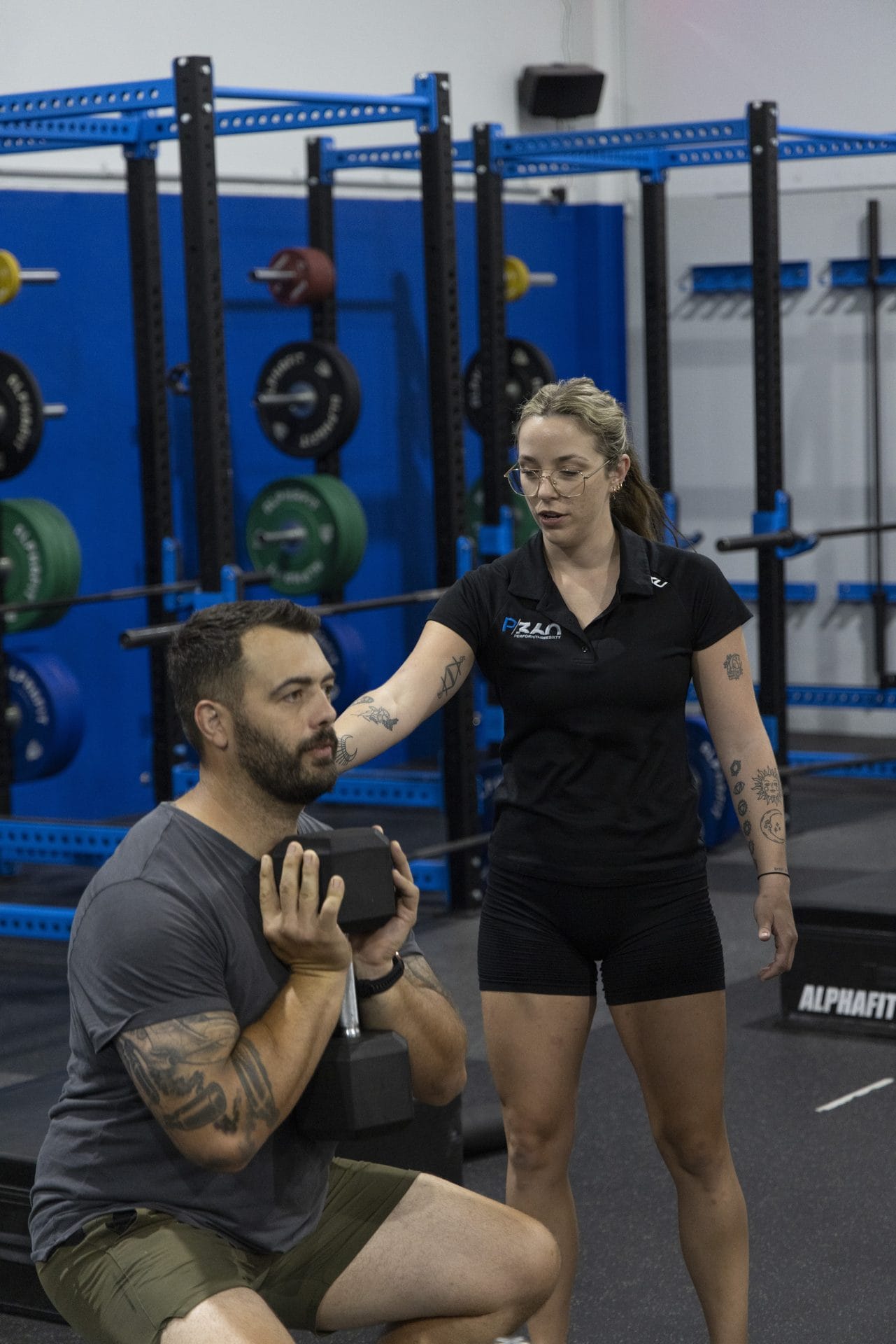 Coach cueing a member during a session